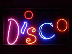 disco sign in multicoloured neon