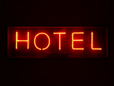 hotel sign in red neon