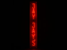 jay jay's sign in red neon